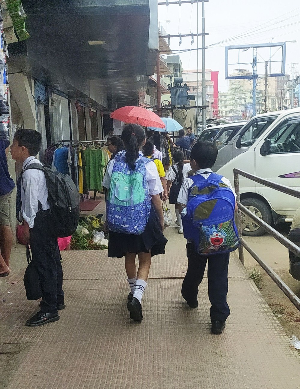 Students walking back home after school carrying heavy bags on their rather small backs. (Morung Photo | For Representational Purpose only)